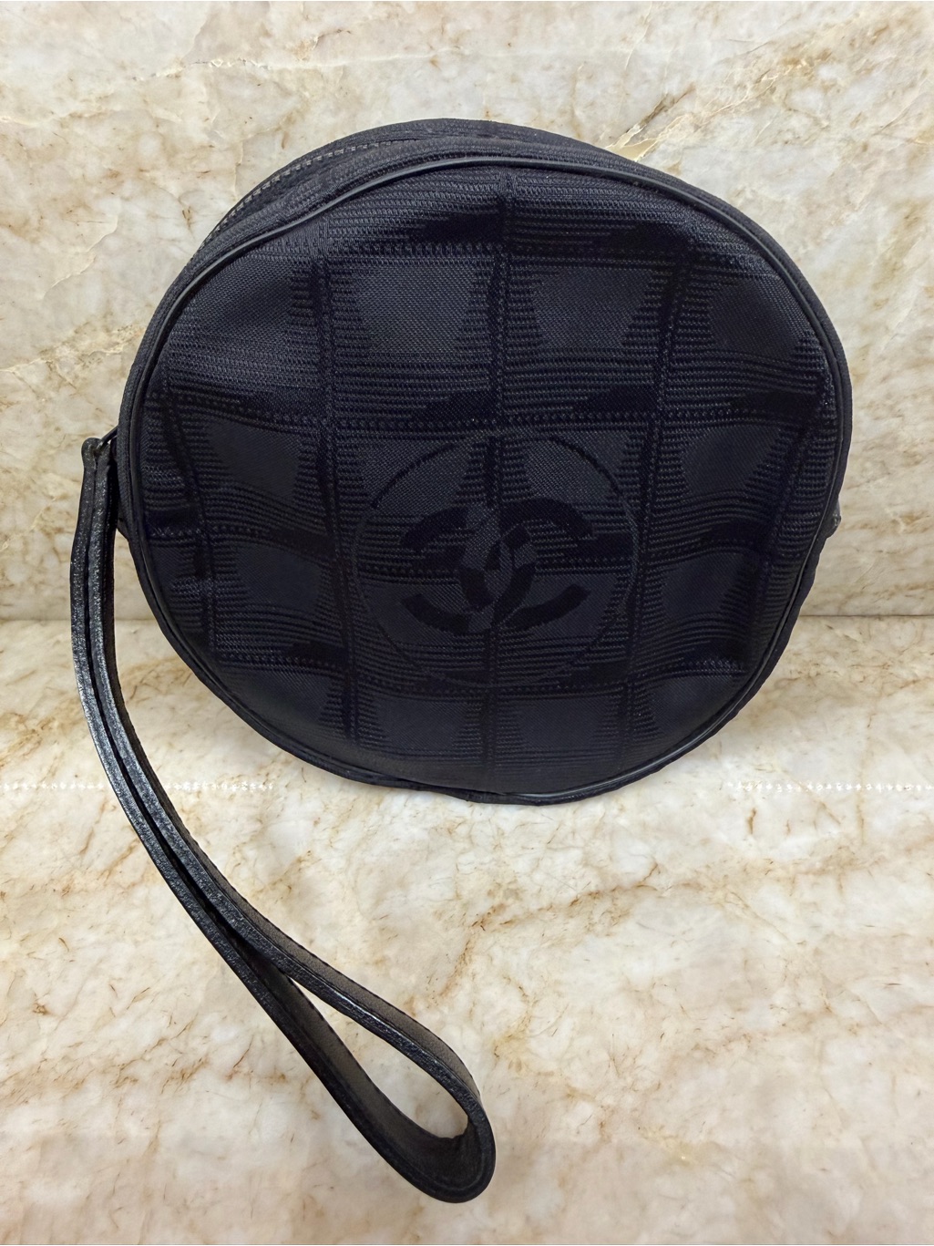 Chanel Black Quilted Round Wristlet With Interlocking Cc Motif